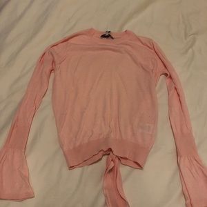 Long-sleeve pink blouse with bell sleeves